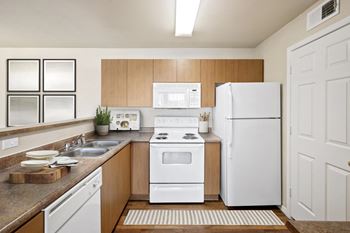 Kitchen with white stove top oven